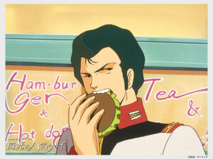 「ガンダム」シリーズの食事シーンには、ハンバーガーをほおばる描写も散見される。『閃光のハサウェイ』場面写真配布キャンペーン「ノア家のアルバム」より　(C)創通・サンライズ